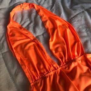 Neon orange body suit